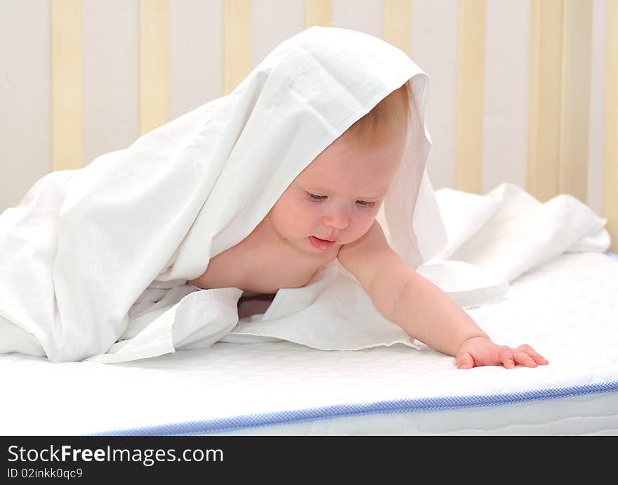 Little baby under white towel. Little baby under white towel.