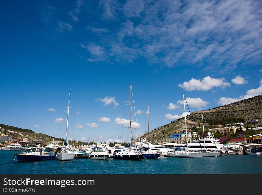 Many boats and yachts near the beach. Many boats and yachts near the beach