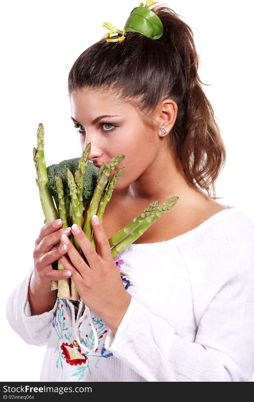 Young beautiful woman wit green fresh vegetables. Young beautiful woman wit green fresh vegetables