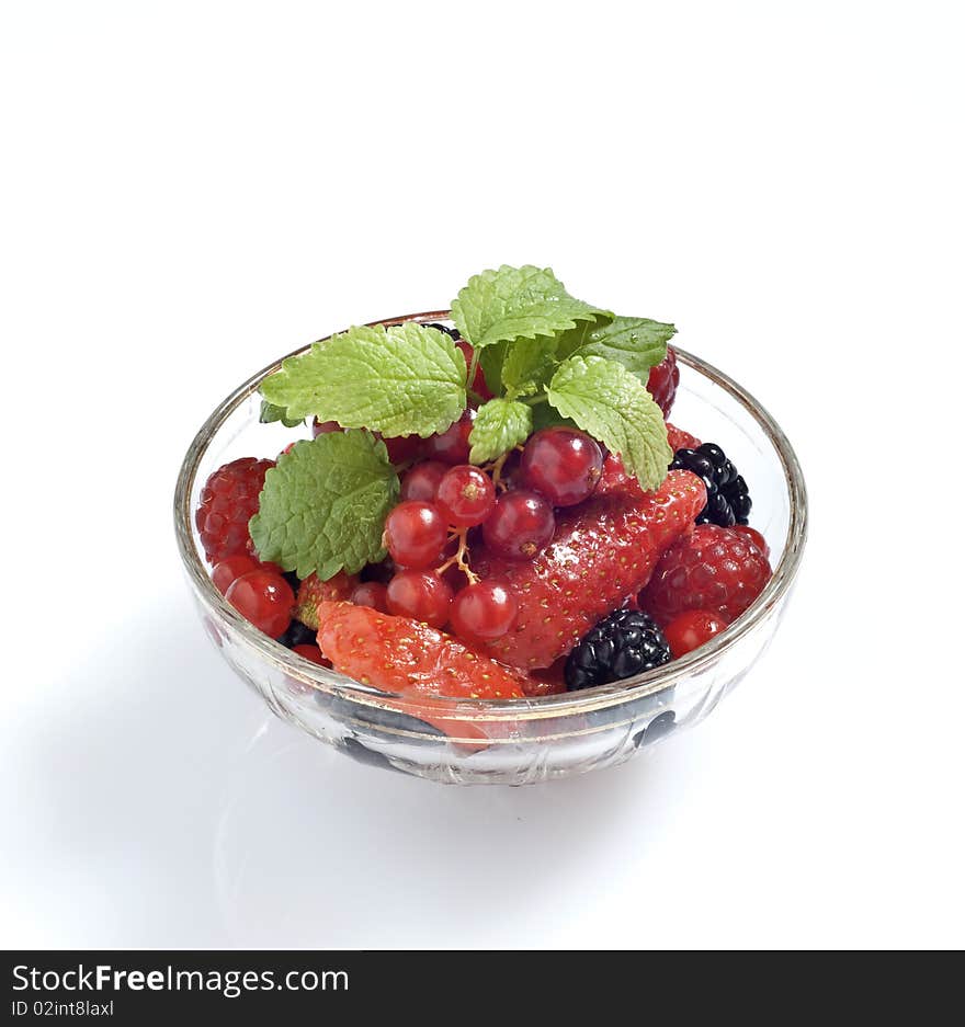 Currant grapes and mint leaves on a white background. Currant grapes and mint leaves on a white background