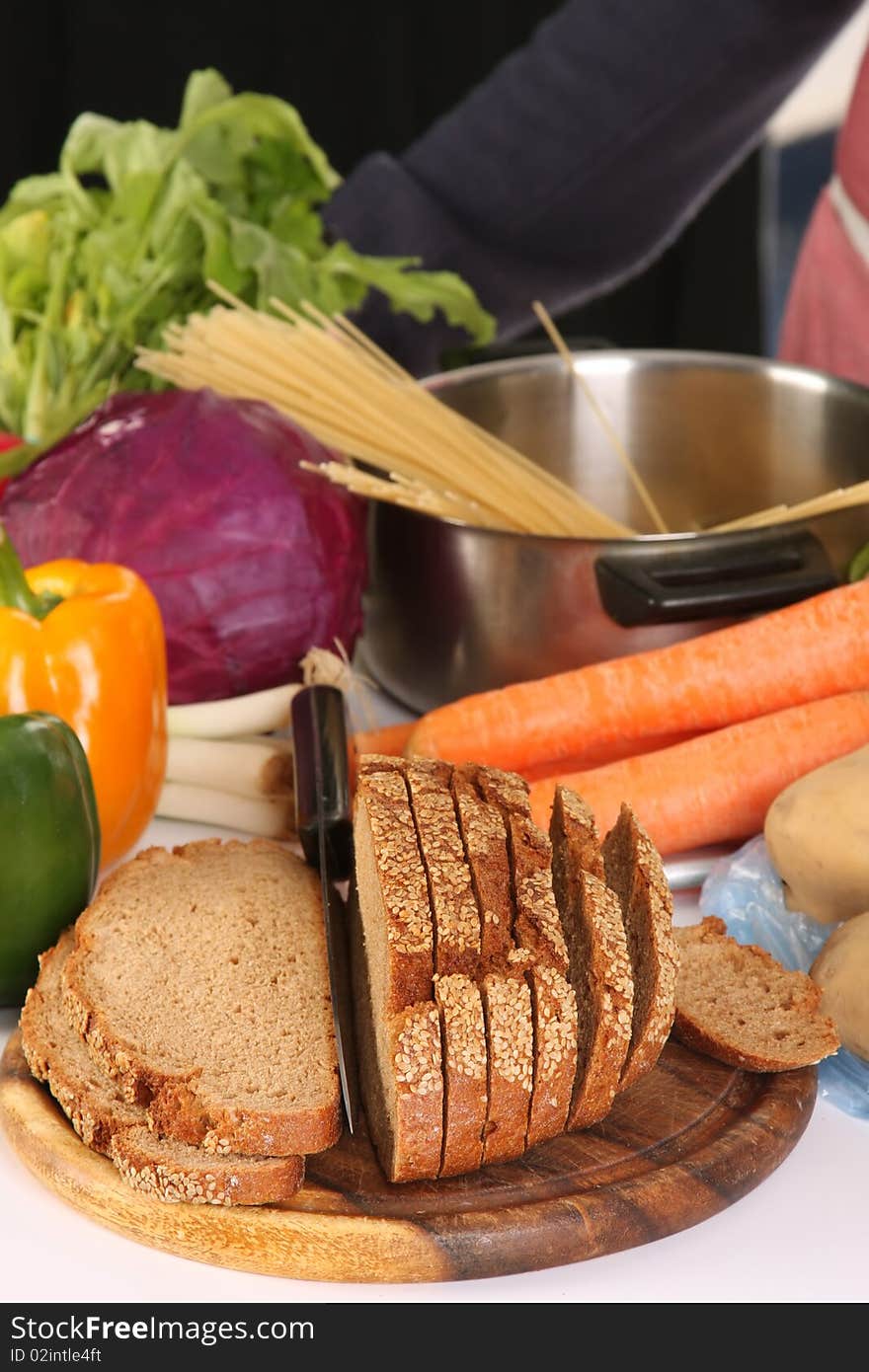 Bread, carrot, red cabbage and peppers in close up. Bread, carrot, red cabbage and peppers in close up