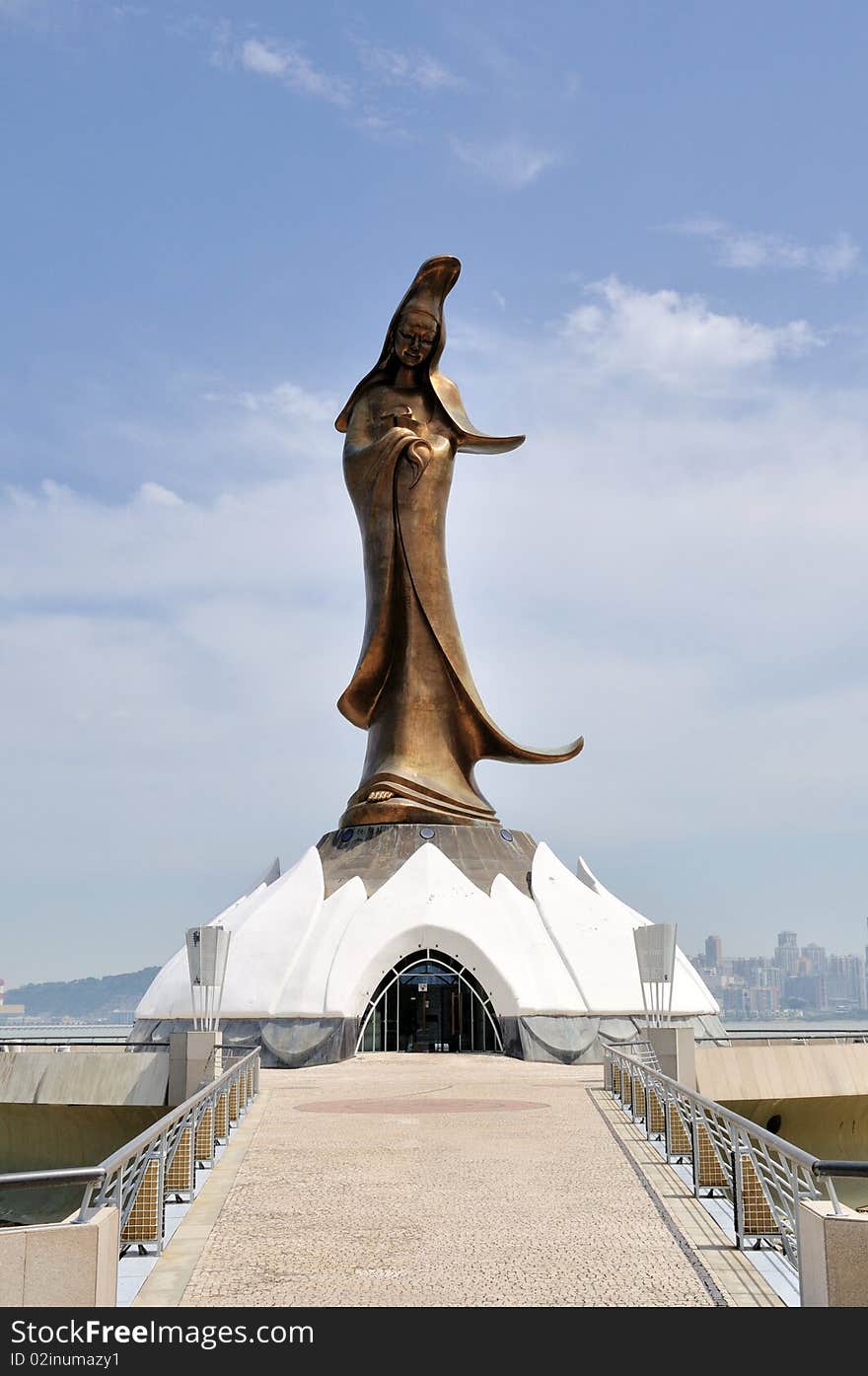 Kun Iam Statue is a 32-metre tall statue of the goddess of mercy, a much revered deity in Macau. It is located on a manmade island off the Macau peninsula, and linked to it by a 60-metre causeway. Geomancy was employed to determine the most auspicious location to position the statue, to align it with Guia Hill and the Kun Iam Temple. The Kun Iam statue is clad in bronze. It weighs 50 tonnes and is 20 metres tall. It was cast at a foundry in Nanjing, one of the largest foundries in China.