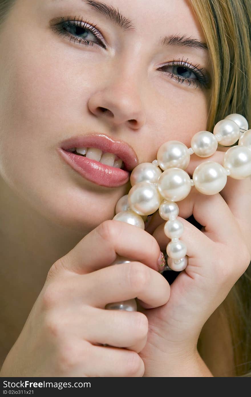 Blond Woman With A Pearl Necklace