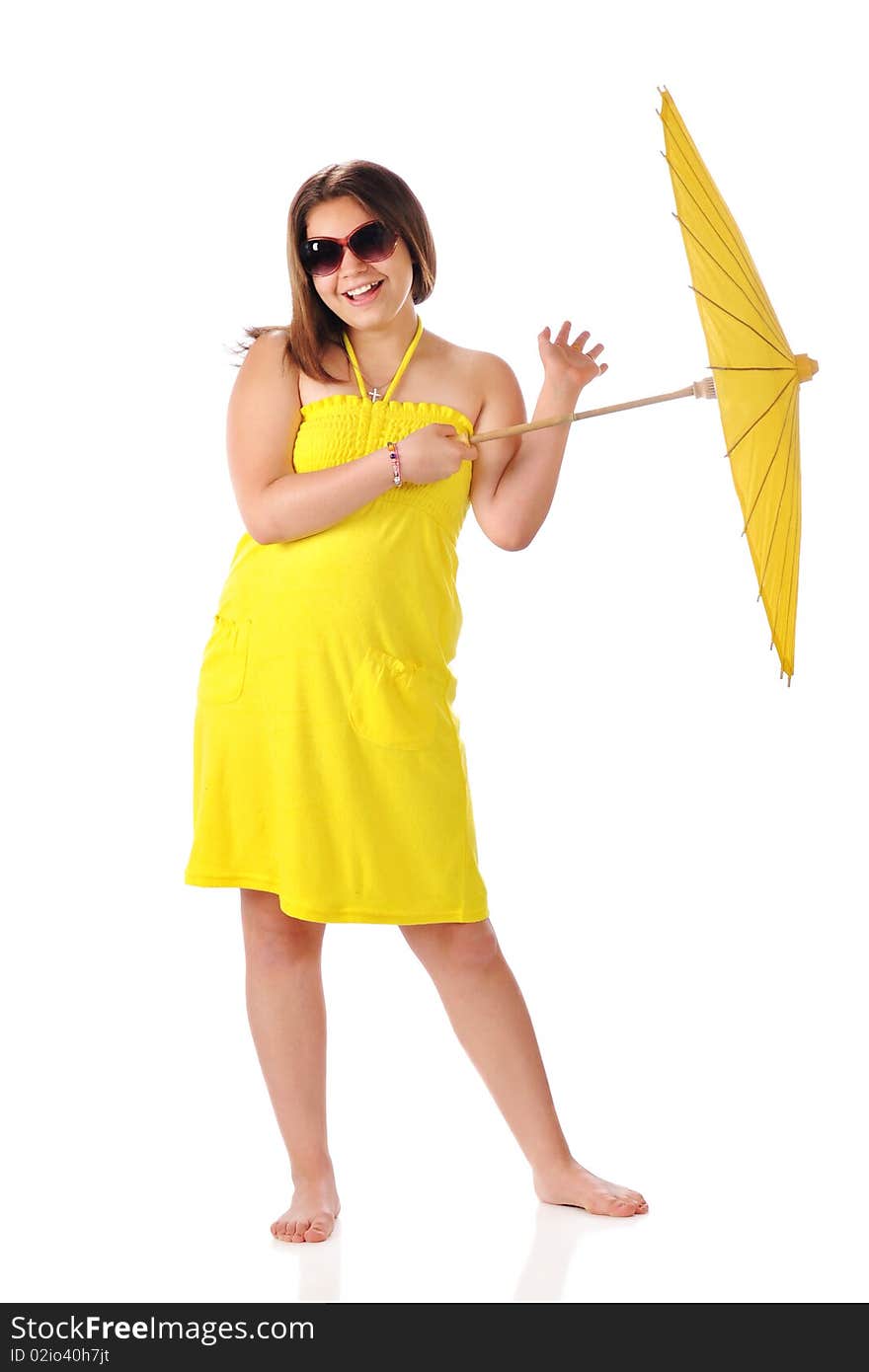 A barfoot young teen happily twirling a parasol while wearing sunglasses and a bright yellow sundress. Isolated on white. A barfoot young teen happily twirling a parasol while wearing sunglasses and a bright yellow sundress. Isolated on white.