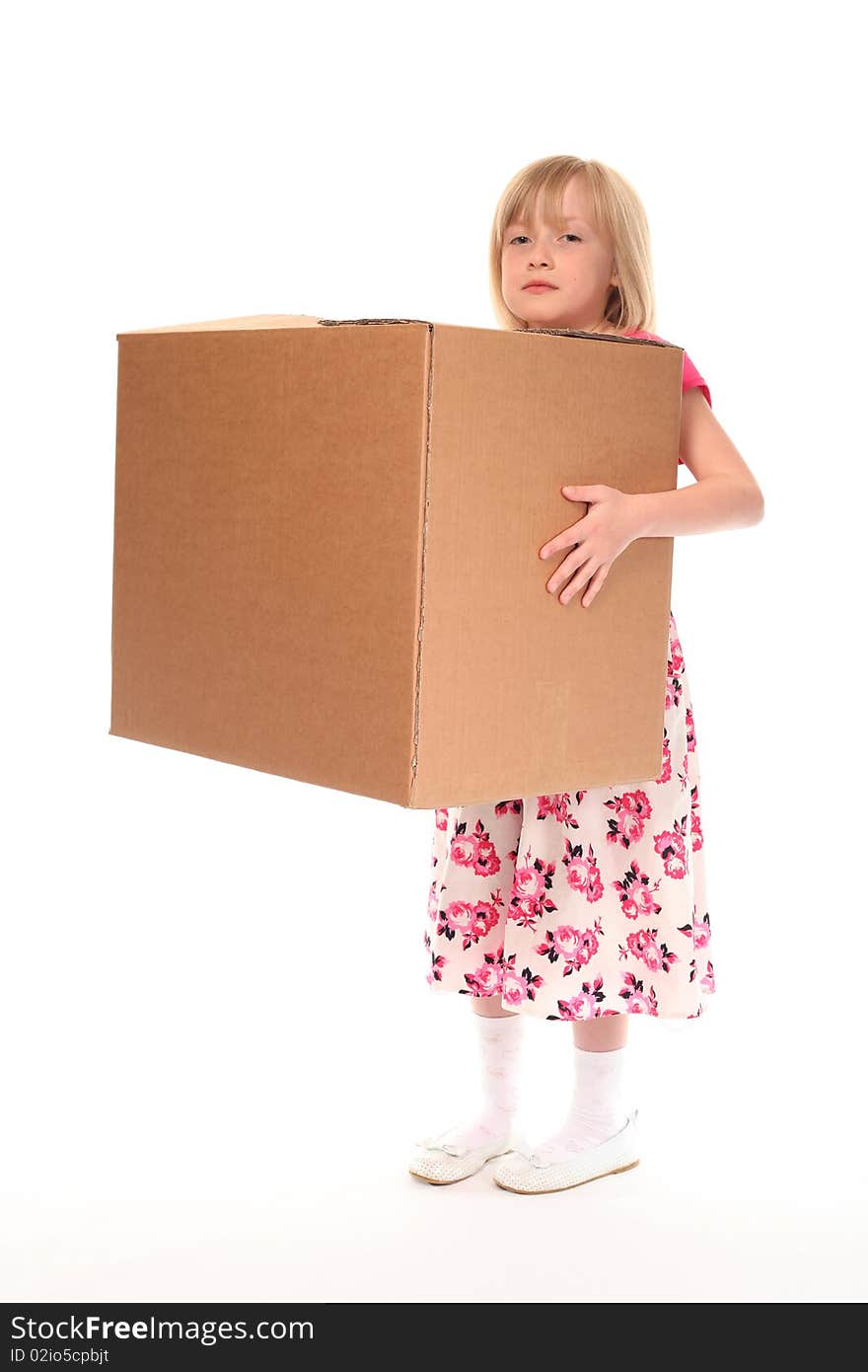 Young little girl holding large cardboard box. Young little girl holding large cardboard box