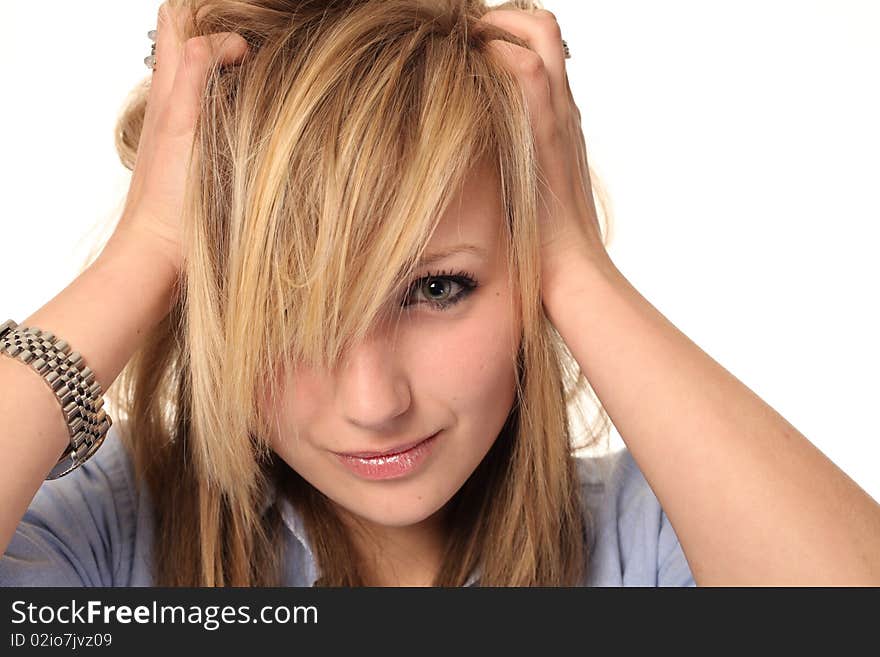 Attractive young teenage girl isolated on white background, with messy hair looking stressed. Attractive young teenage girl isolated on white background, with messy hair looking stressed