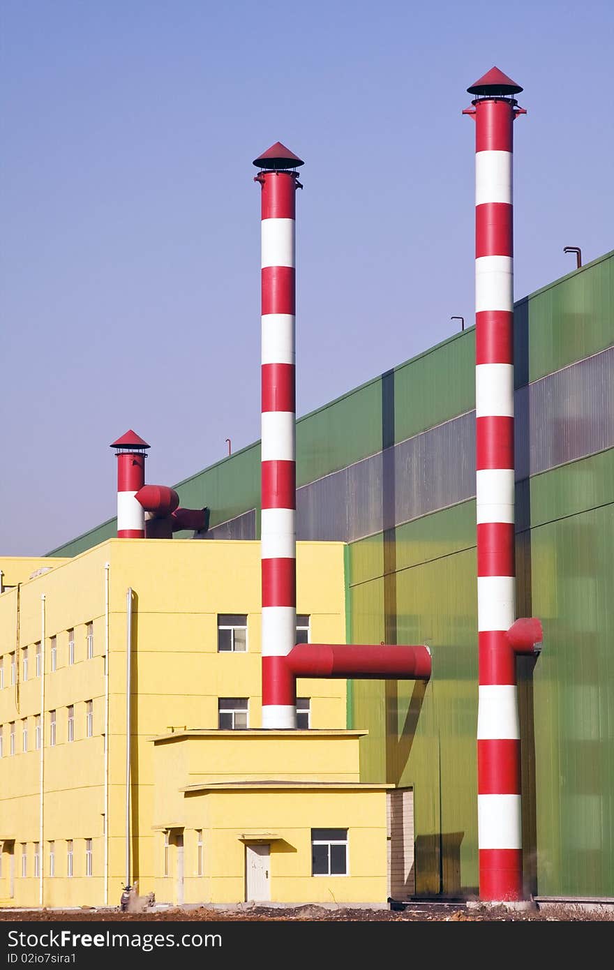 Industrial building against blue sky. Industrial building against blue sky