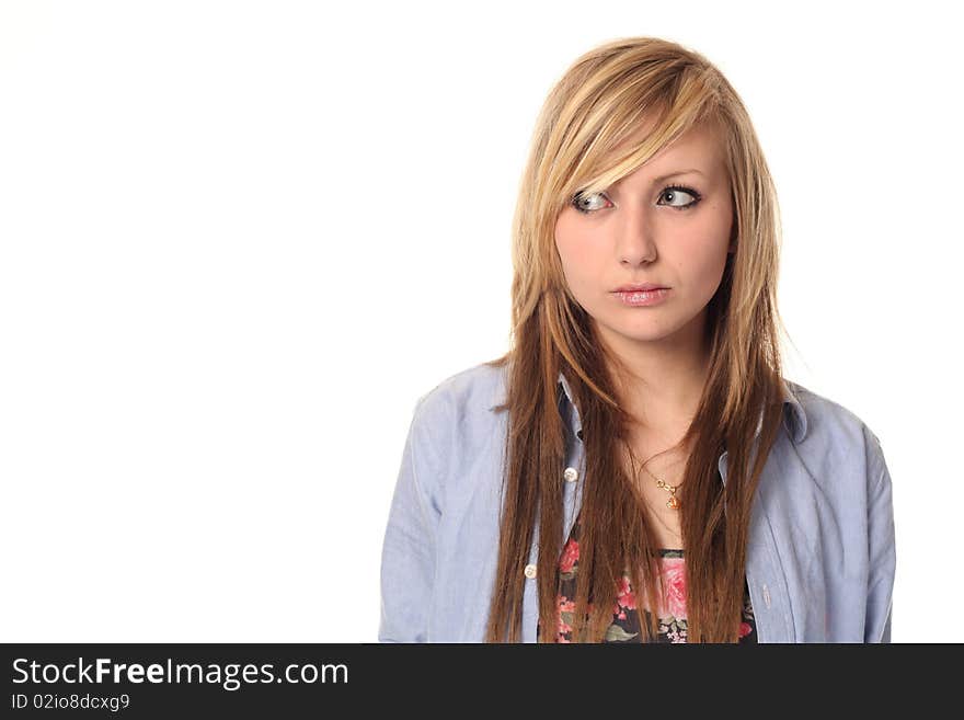 Attractive young teenage girl isolated on white background, looking sideways. Attractive young teenage girl isolated on white background, looking sideways