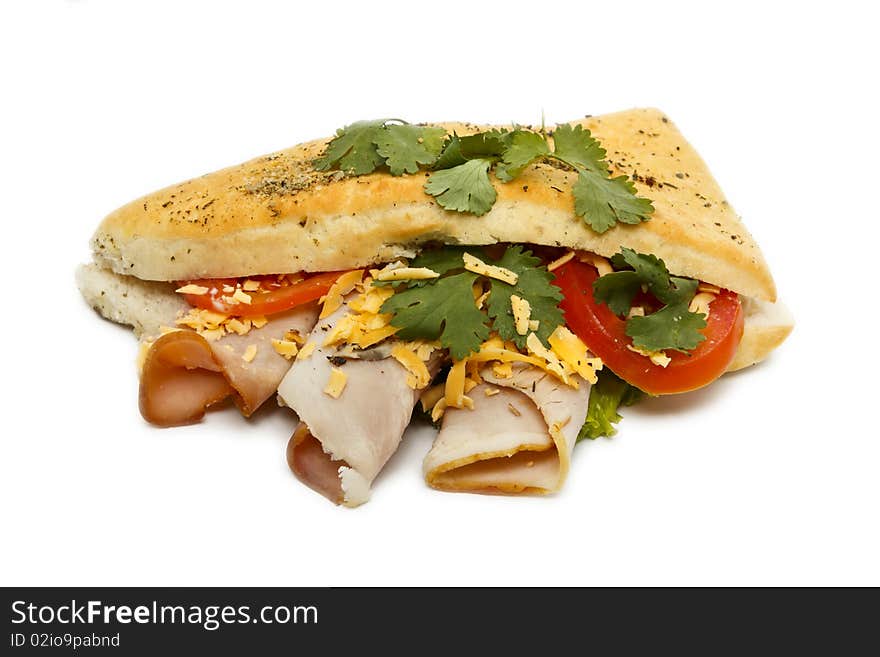 Panino with ham, cheese and tomato isolated on a white background