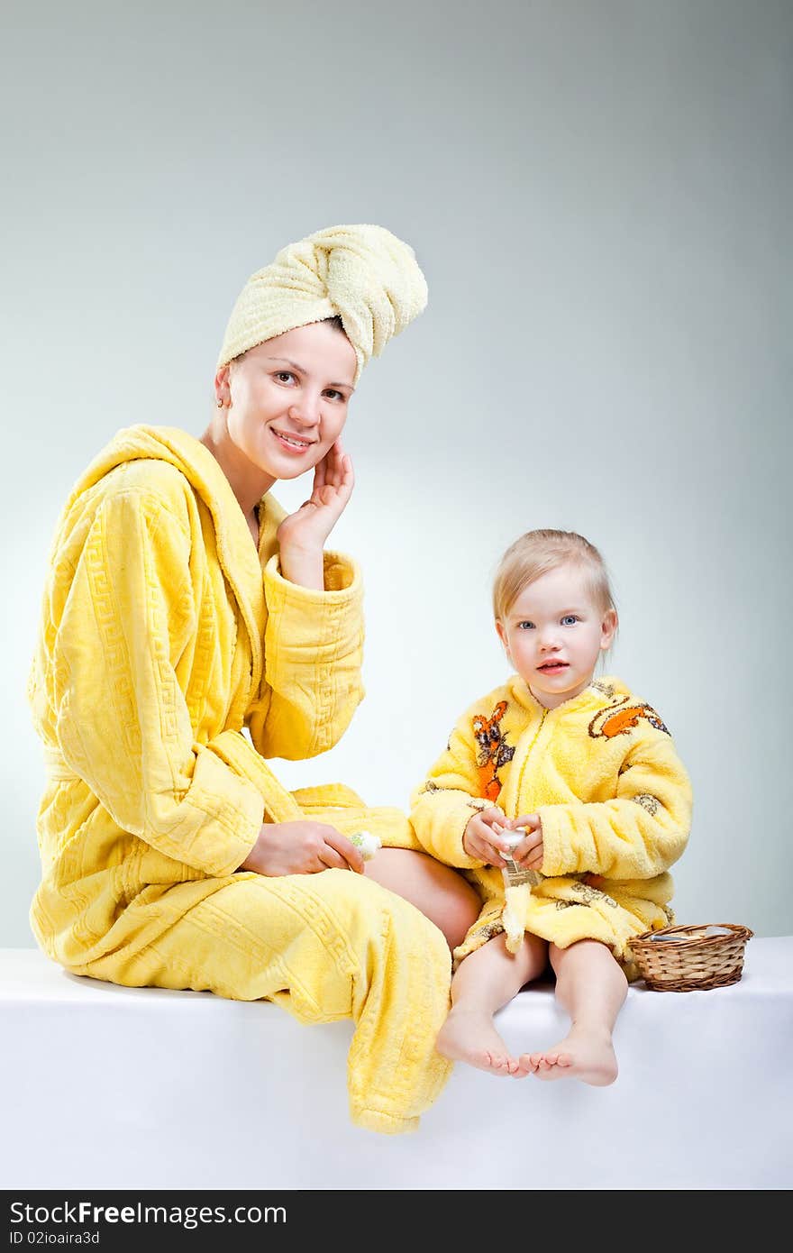 Little daughter with her young mother