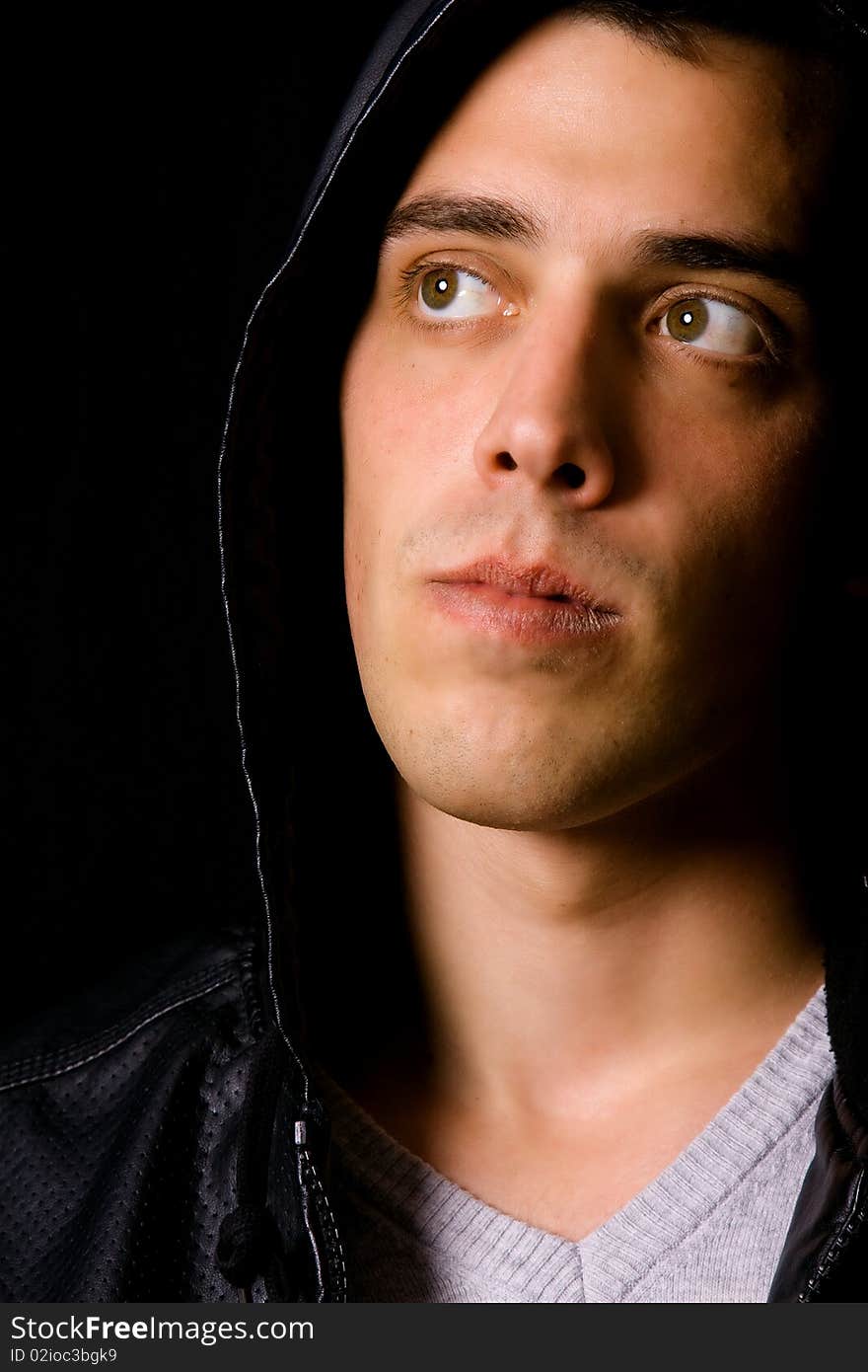 Portrait of a young casual man on black background. Portrait of a young casual man on black background