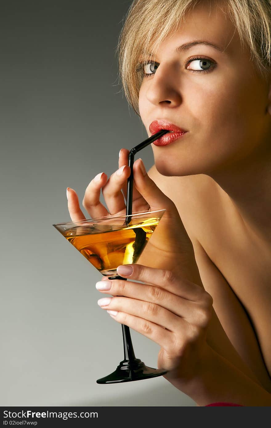 Beautiful woman with glass of cocktail