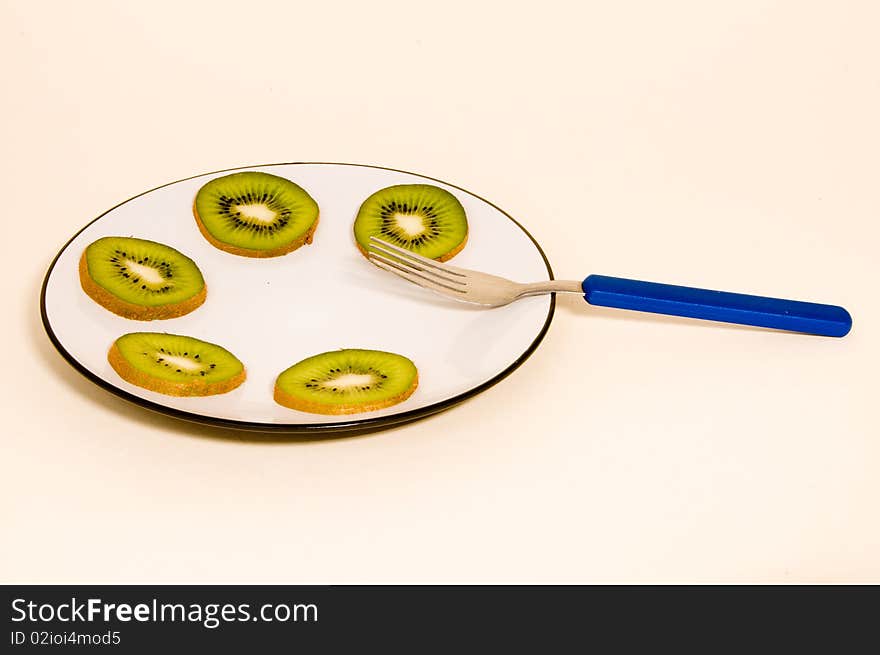 Kiwi slices on a plate.