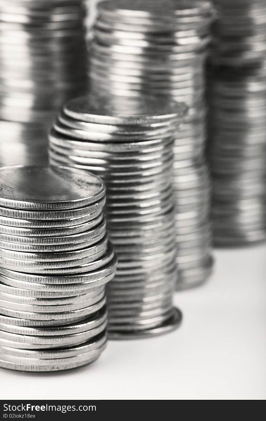 Stacks of silver coins over white. Stacks of silver coins over white