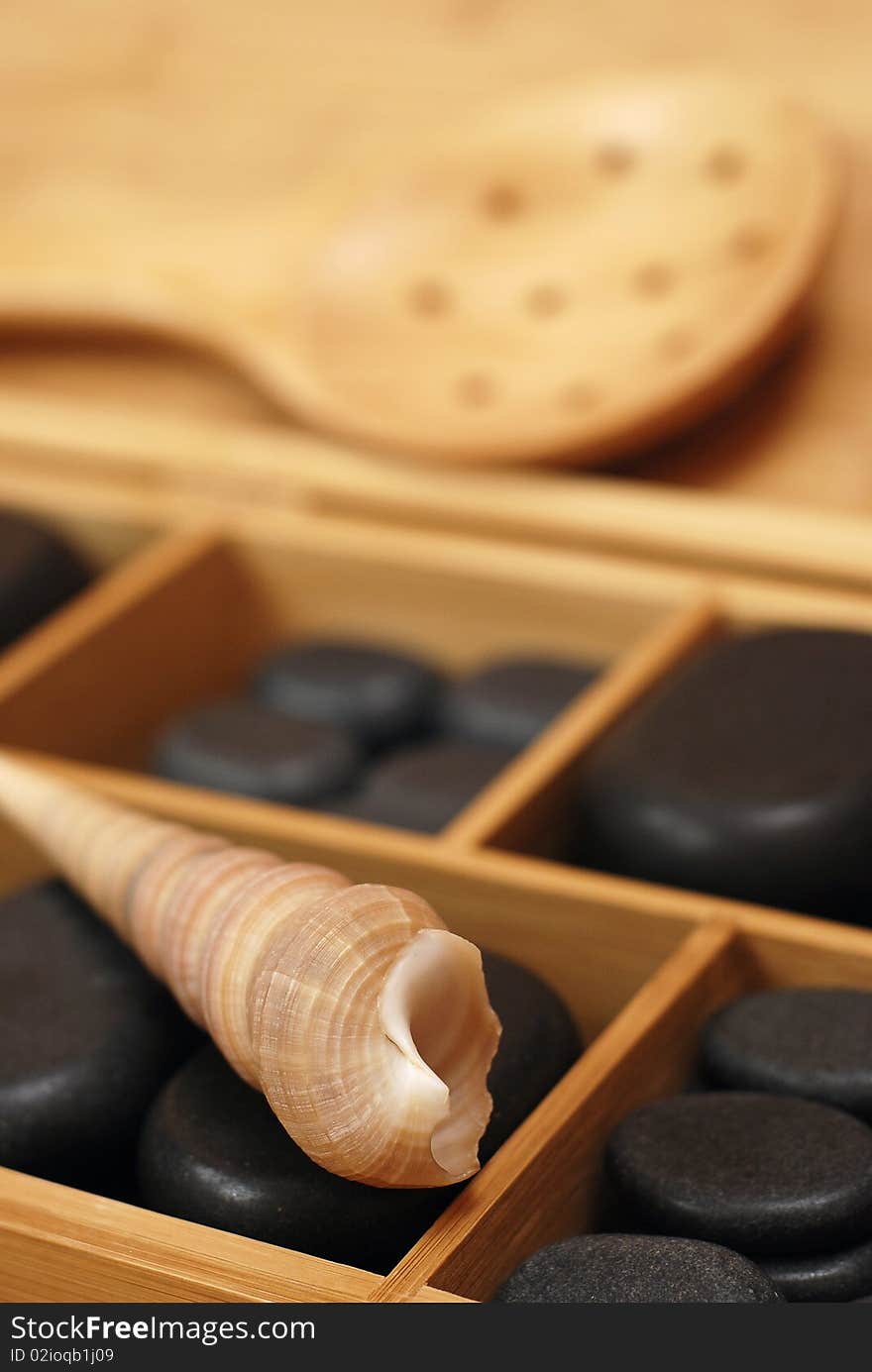 Box with stones for massage and with shell