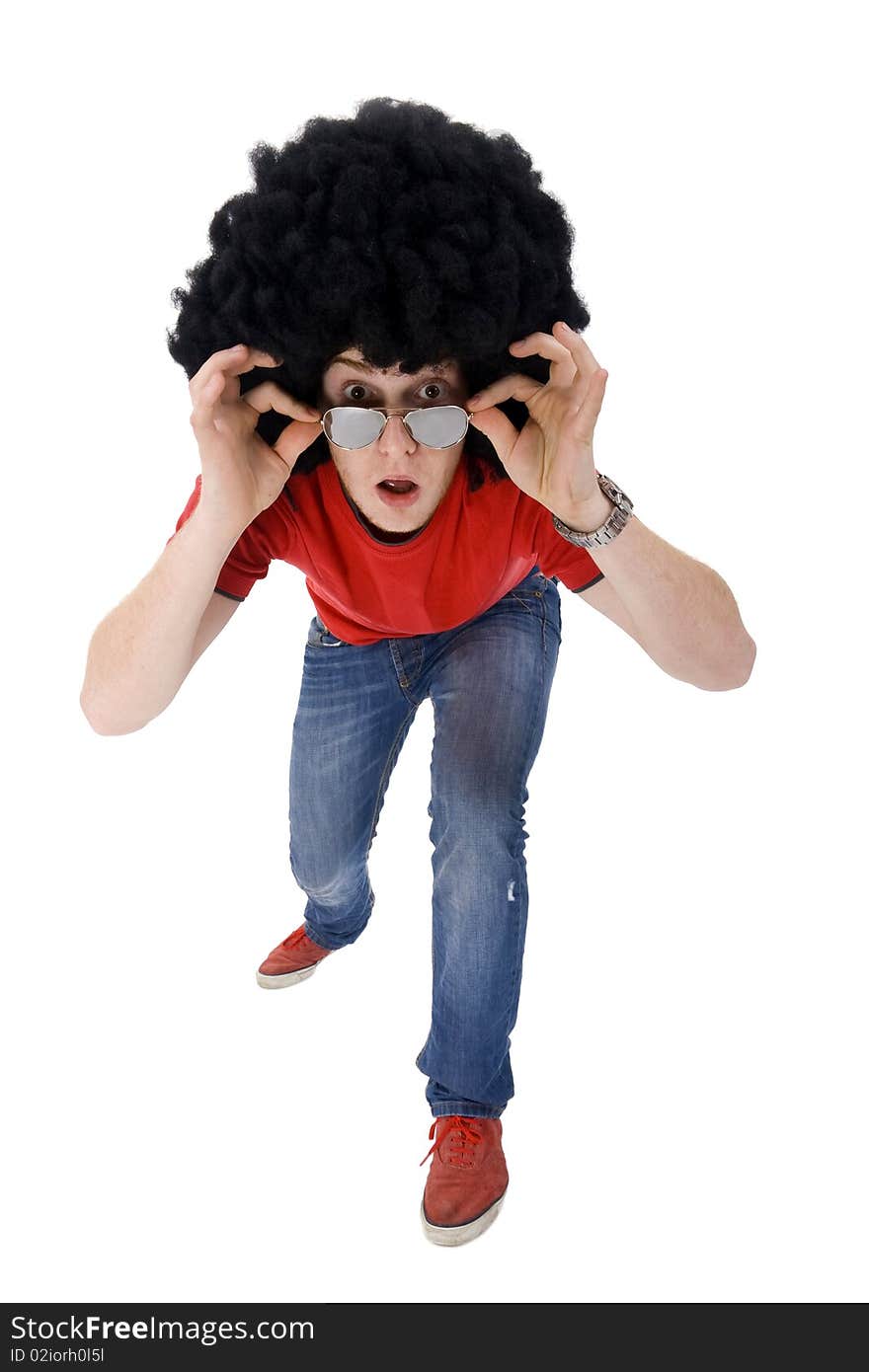 Astonished young casual man looking at something on a white background. Astonished young casual man looking at something on a white background