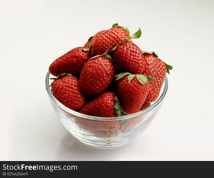 Juicy strawberries in a glass bowl. Juicy strawberries in a glass bowl