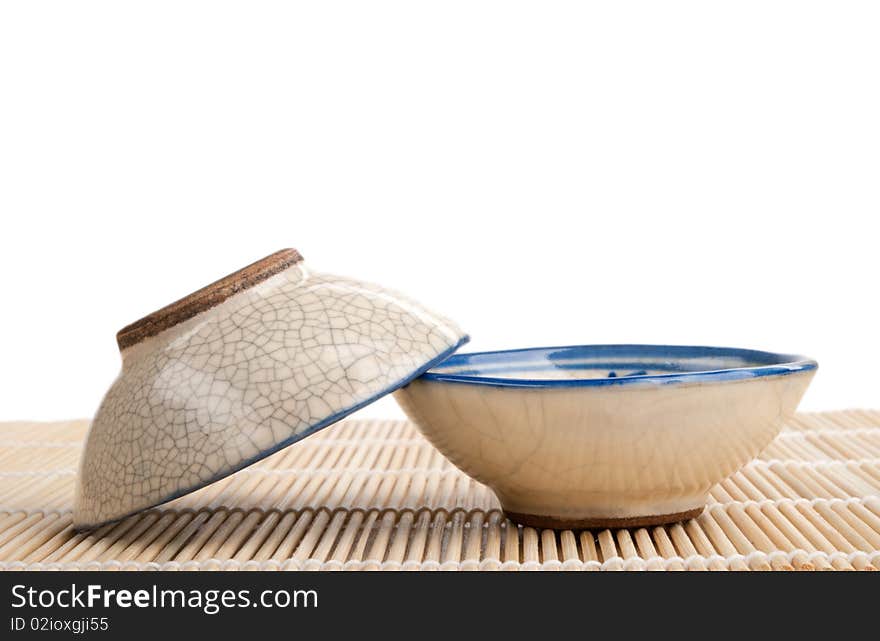 Two Tea Cups Lie On Mat