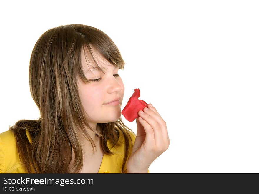 Girl Holds Petal Of Flower And Smells