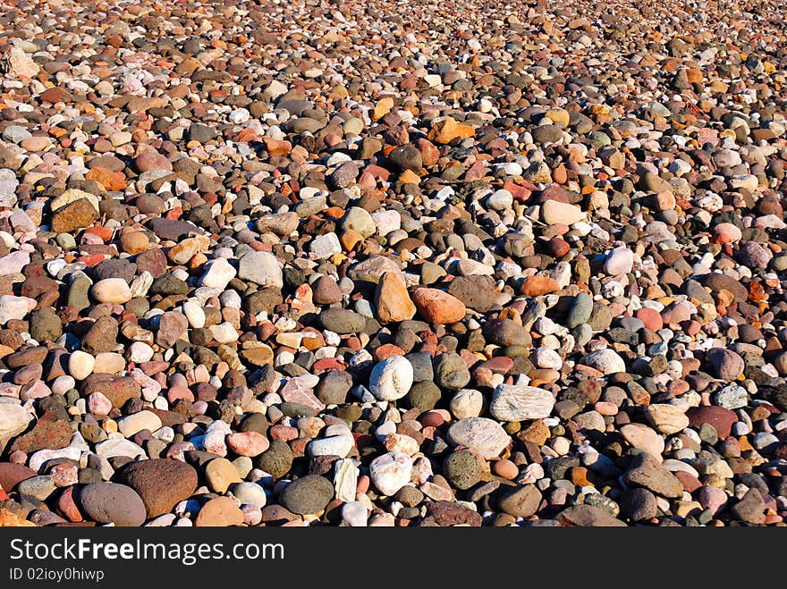 A textured background of beach pebbles.