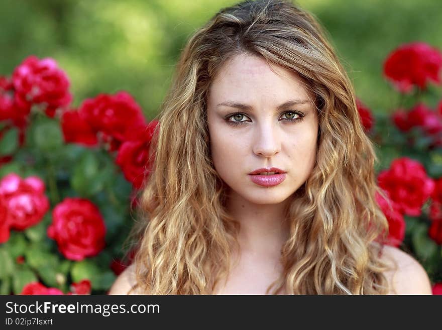 Beautiful female white model with Red Roses