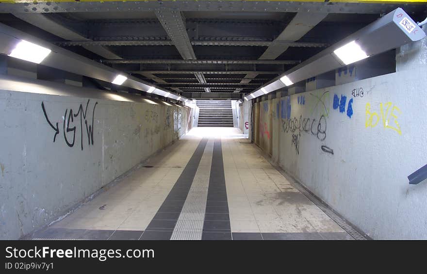 Vintage Tunnel Walkway at a Train Station with new Lights and ancient Steel Ceiling Construction Underpass