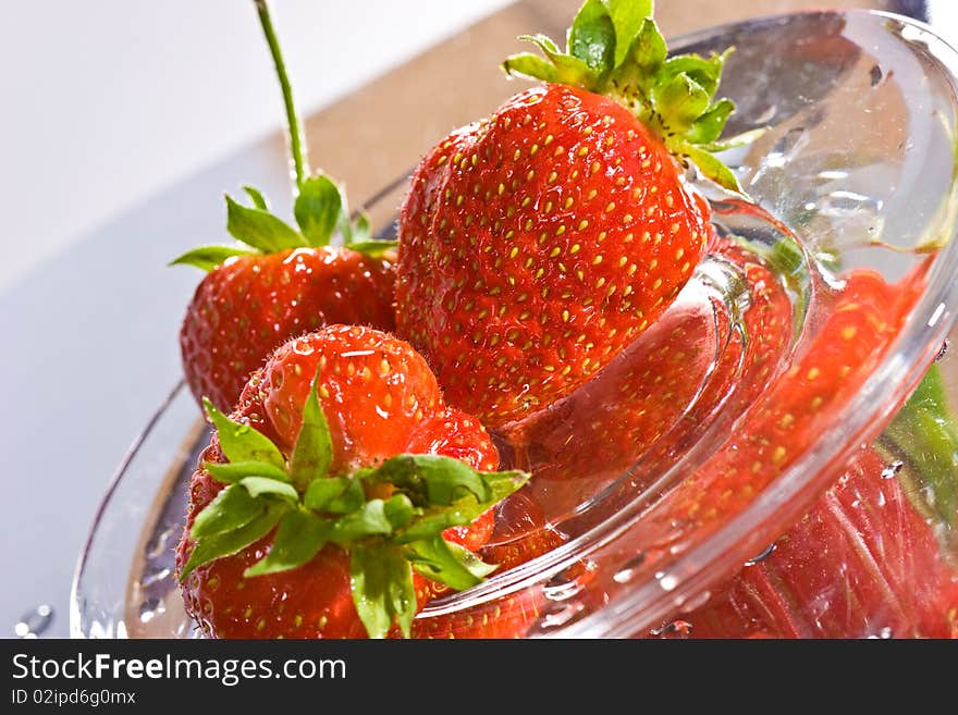 Food series: strawberry on the reflective surface