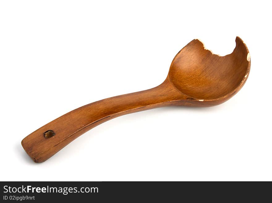 Brown wooden Spoon from which have bitten off a piece isolated on white background. Brown wooden Spoon from which have bitten off a piece isolated on white background