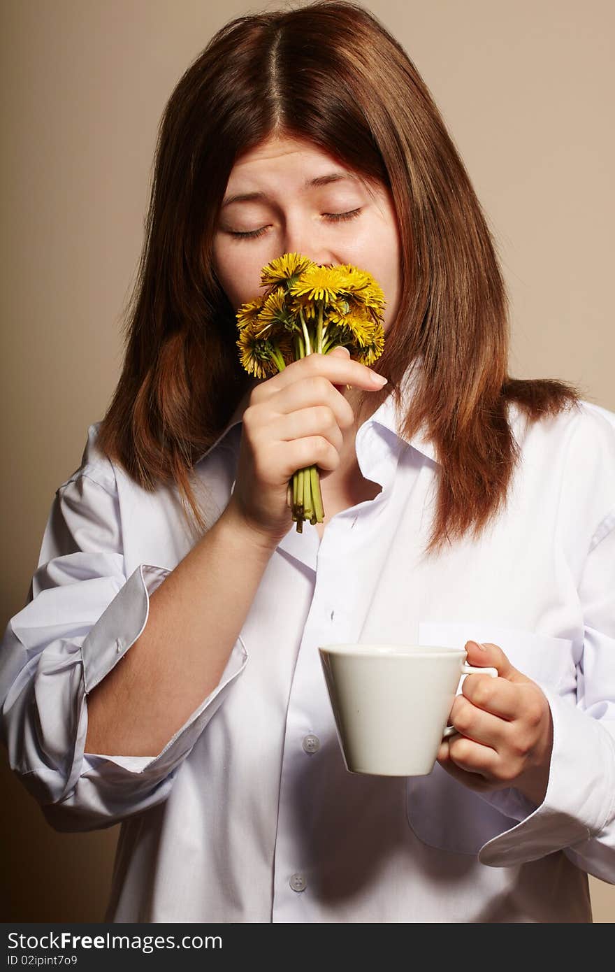 Girl with coffee. studio shot