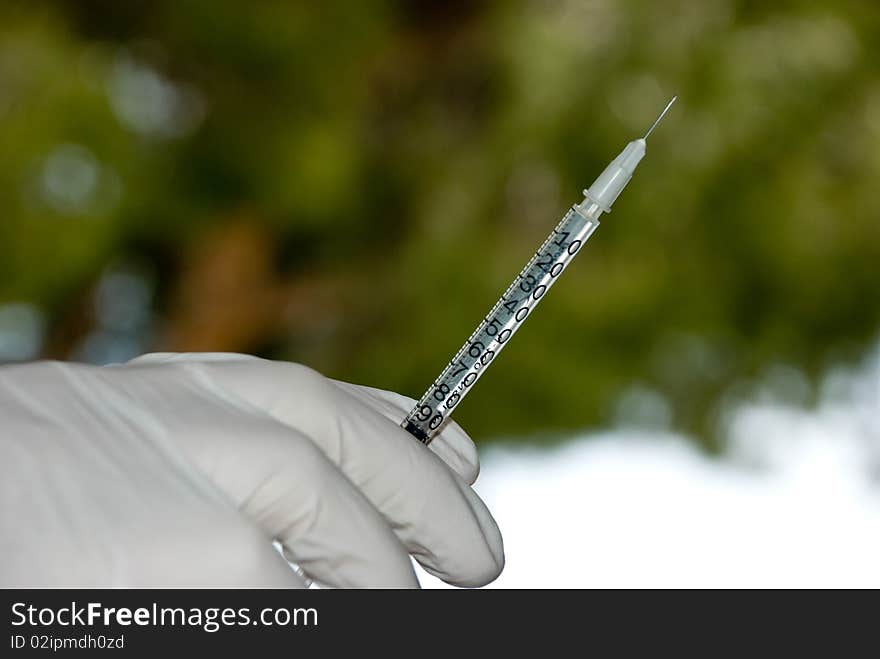 Medical syringe with a needle at the tip