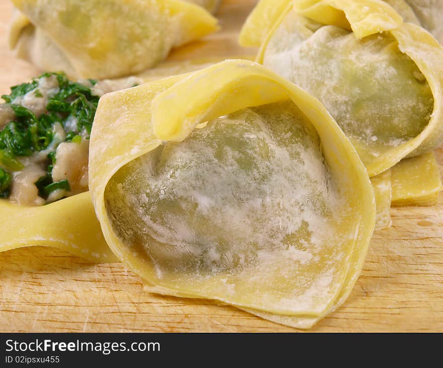 Traditional Chinese Dumplings. Close up. On a wooden plate.