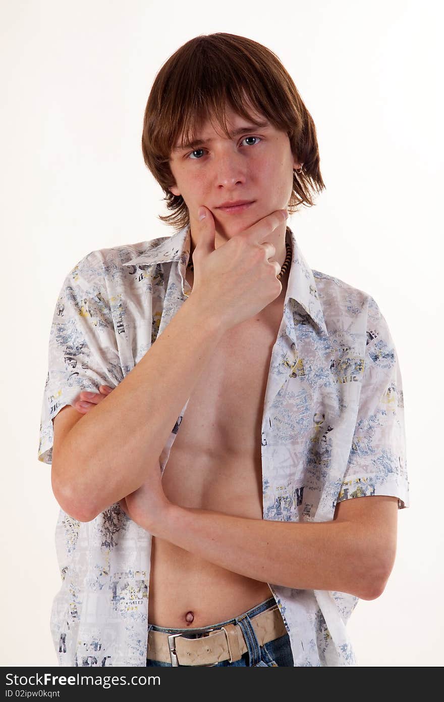 Young man with earring over white background