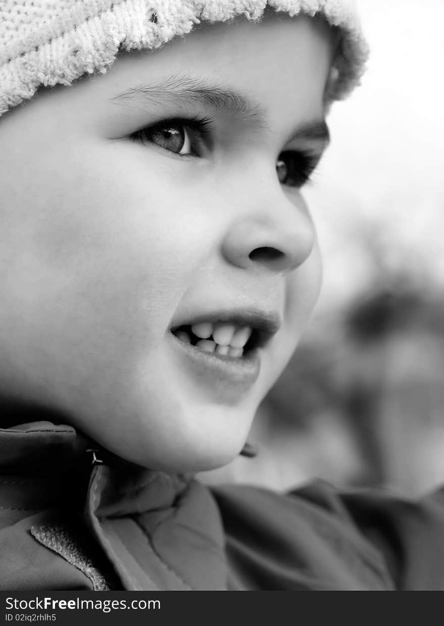 Beautiful little girl happily smiling closeup. Beautiful little girl happily smiling closeup