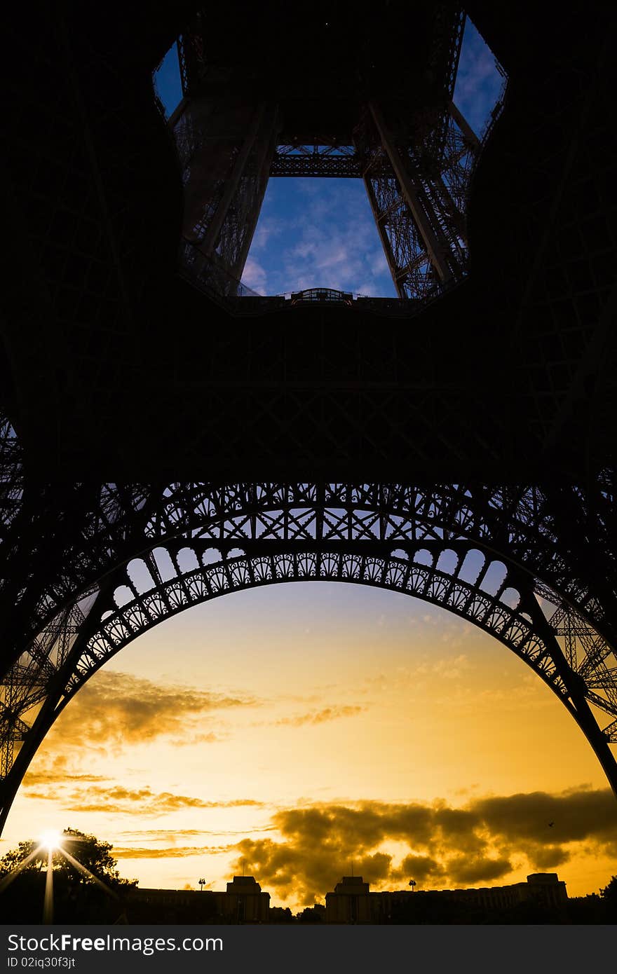 Orange sunset under Eiffel Tower