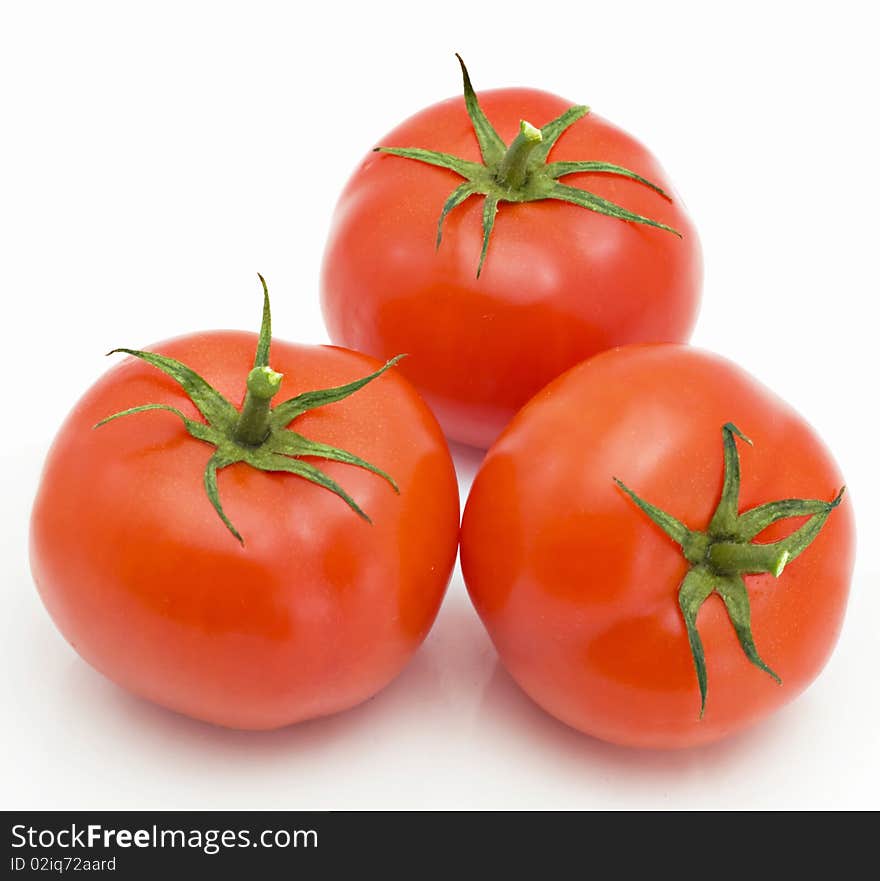 Three tomatoes isolated on the white background