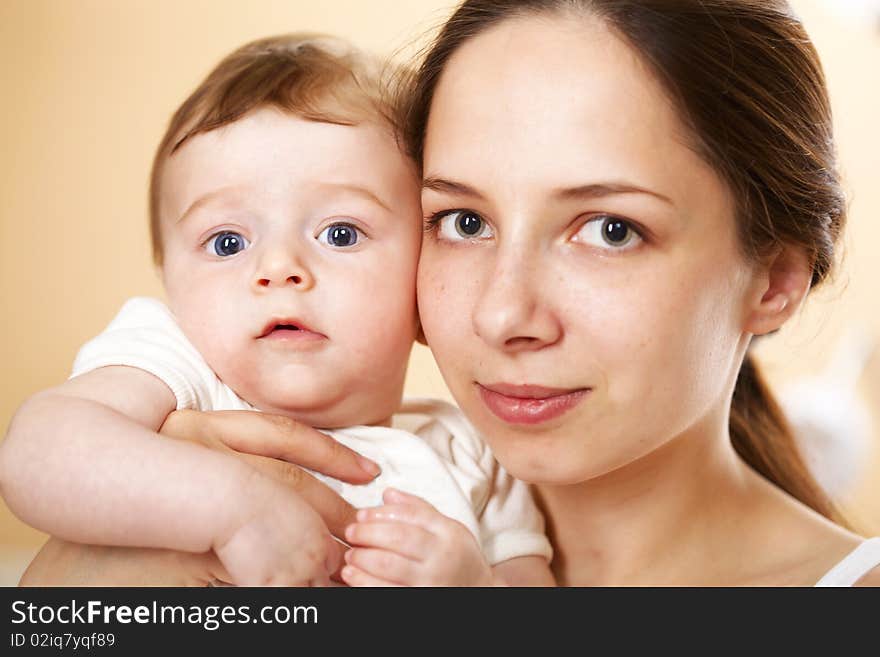 Closeup portrait happy young mother with baby boy