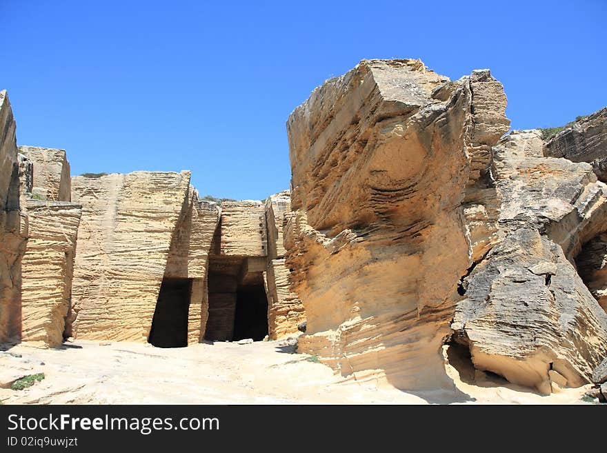 The tuff quarry with its unique stone contrasts with the blue sky