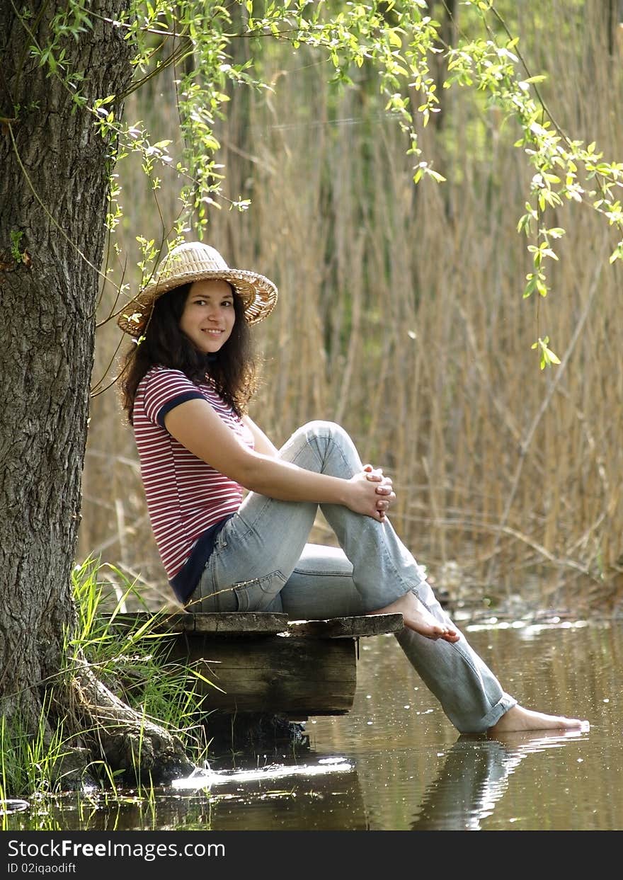 Girl Resting Near Lake