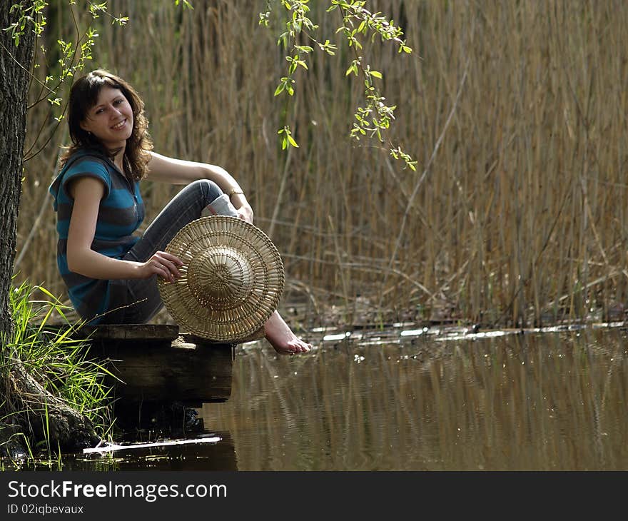 Girl resting near lake