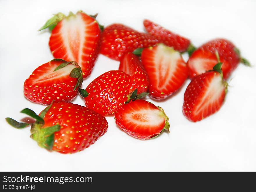 Cut strawberries isolated on the white background