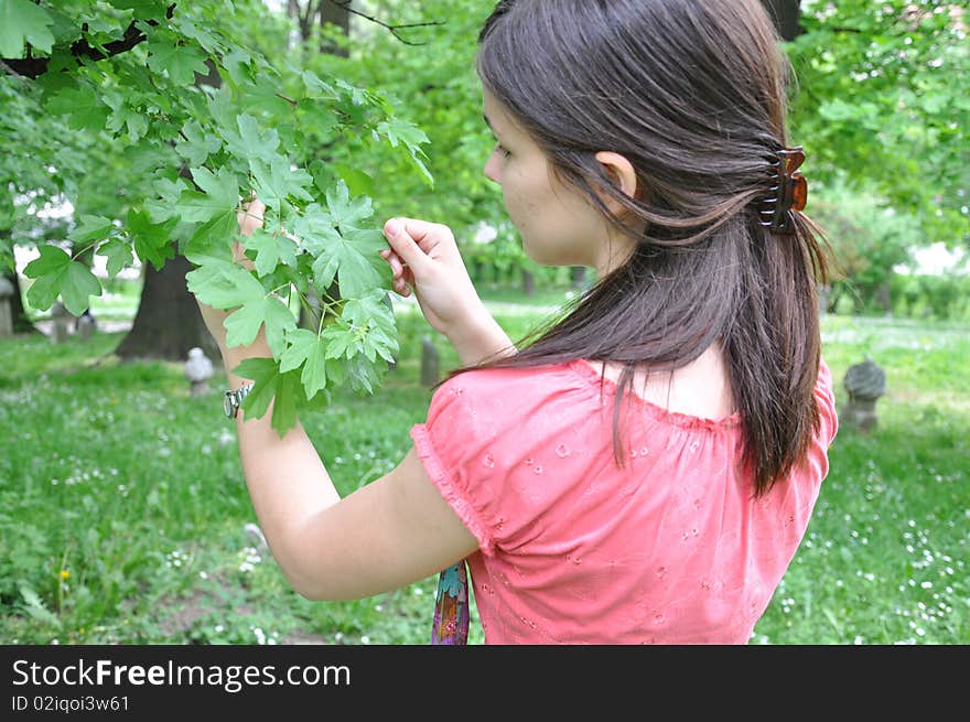 A Young Girl Explores The Trees