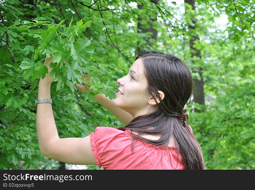 A young girl explores the trees