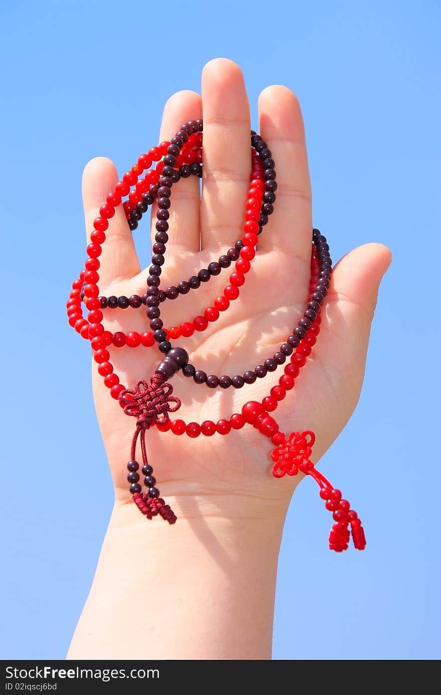 Prayer beads in her hands