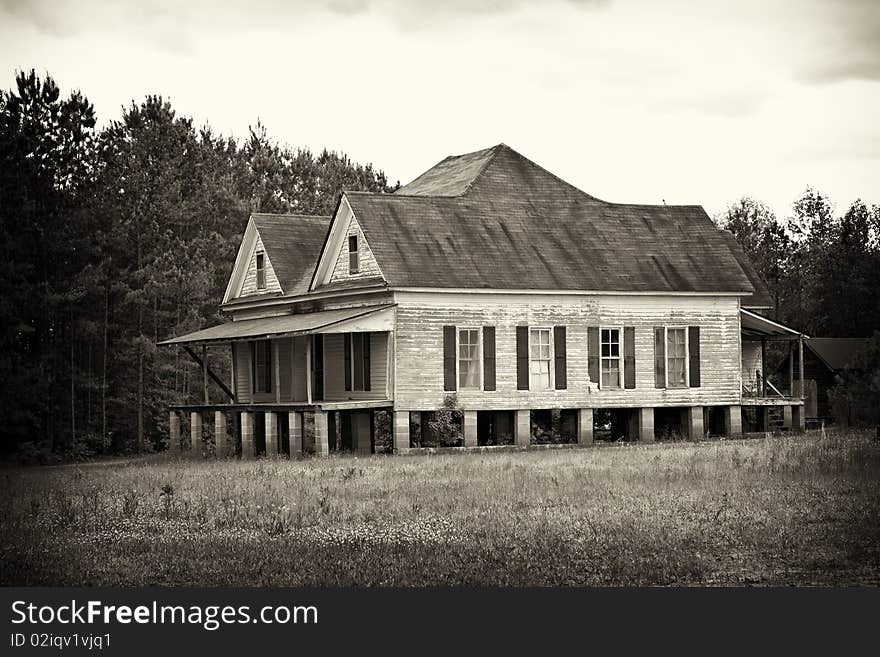 Old abandoned farm house sepia vignetted. Old abandoned farm house sepia vignetted