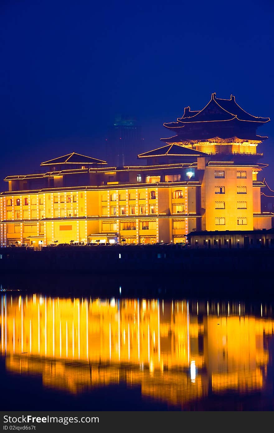 The chinese building in night by the river.