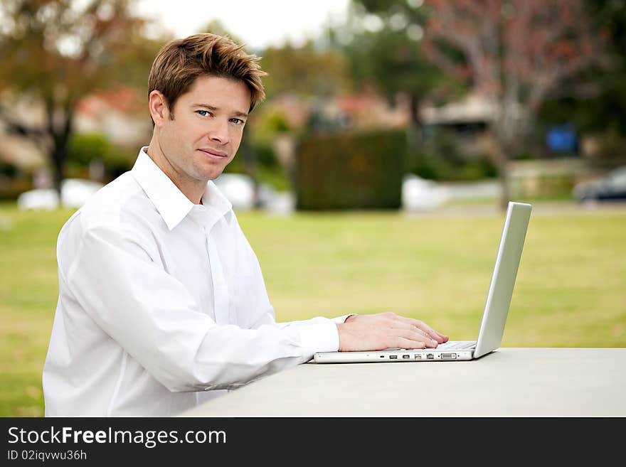 Young business man working outside. Young business man working outside