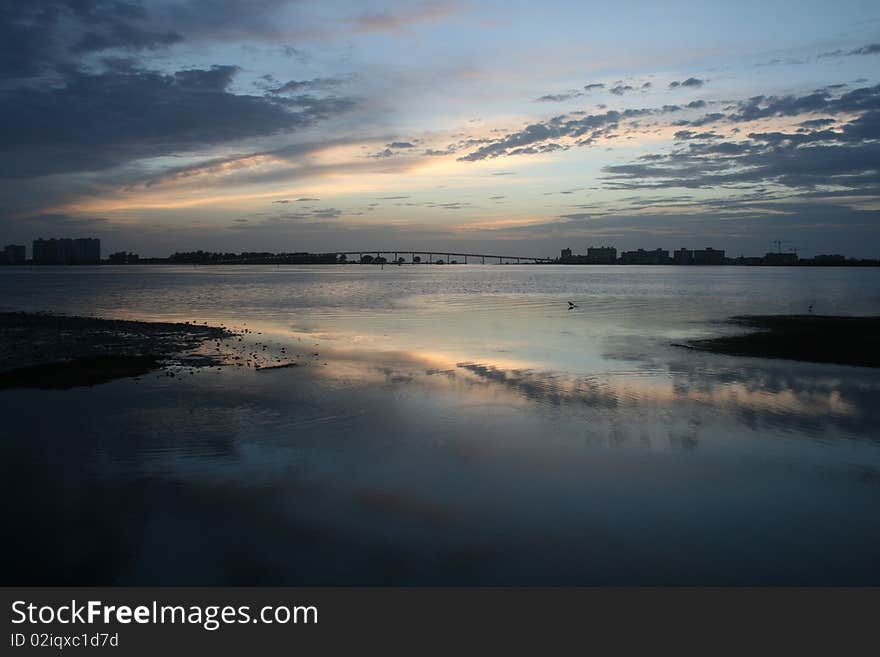 Reflection of the sky on the water at sunset. Reflection of the sky on the water at sunset