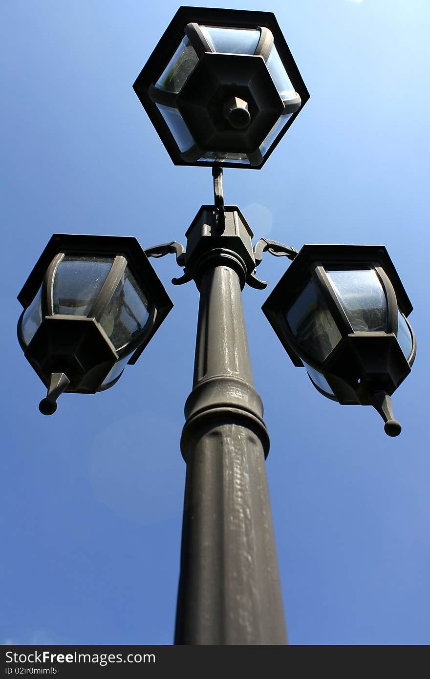 Lamp post under the blue sky