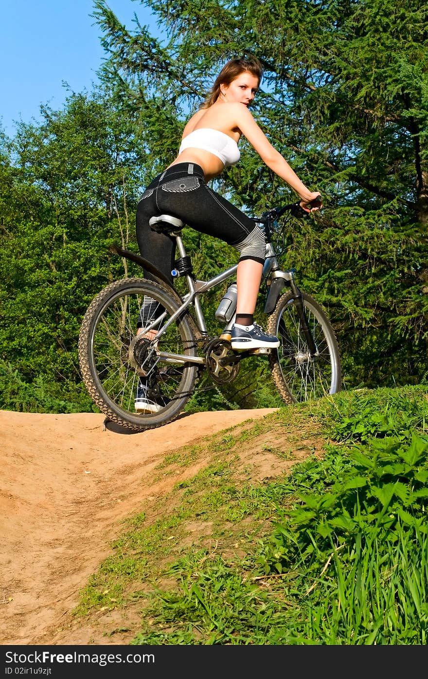 Pretty young woman on bike. Pretty young woman on bike