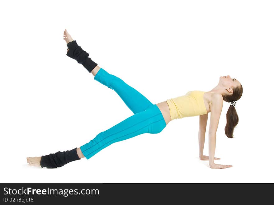 Beautiful girl doing gymnastics on white background